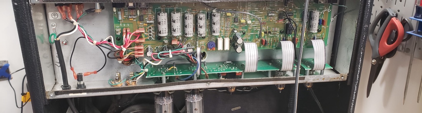 Combo amp opened up on the bench for service