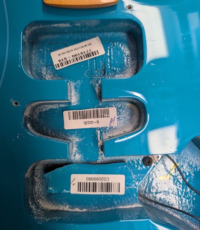 Stratocaster body with shielding applied to the pickup and control routes